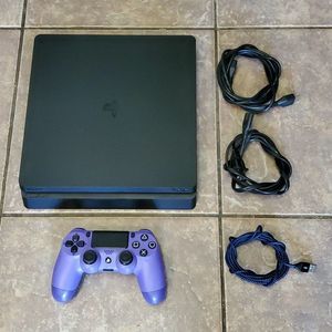 Sony PS4 Slim 1Tb system, power cord, hdmi cord, charging cable and 1 remote.